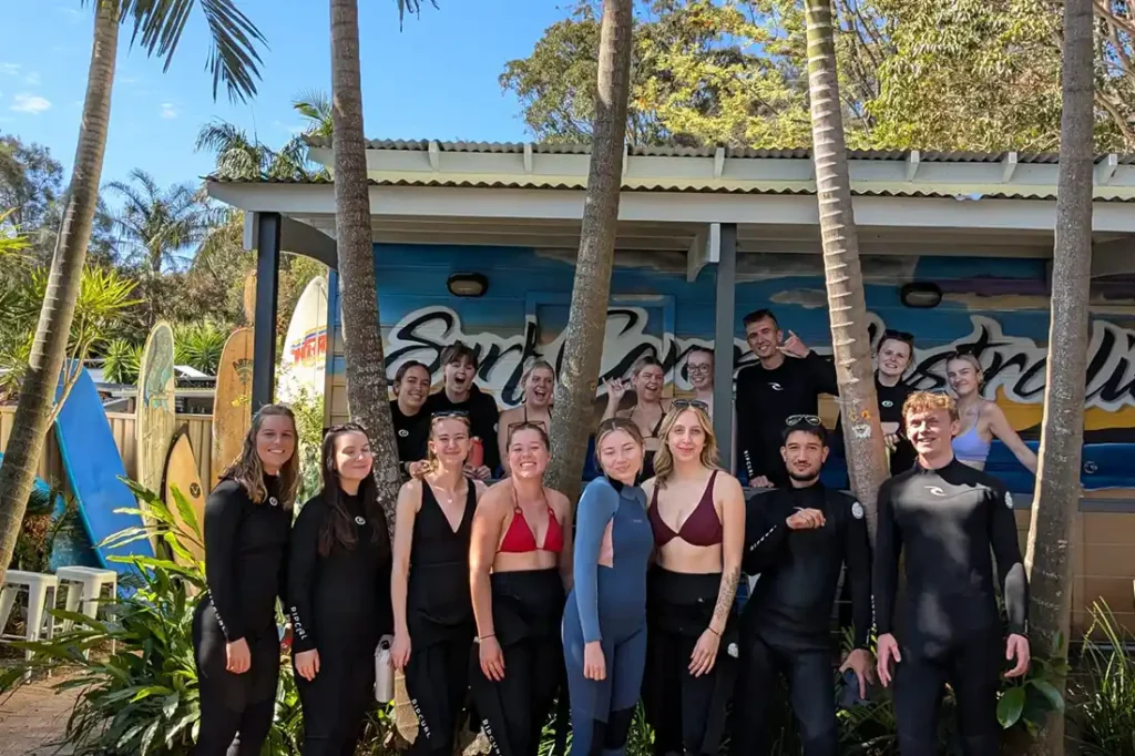 group of working holiday workers in ustralia during surfing course